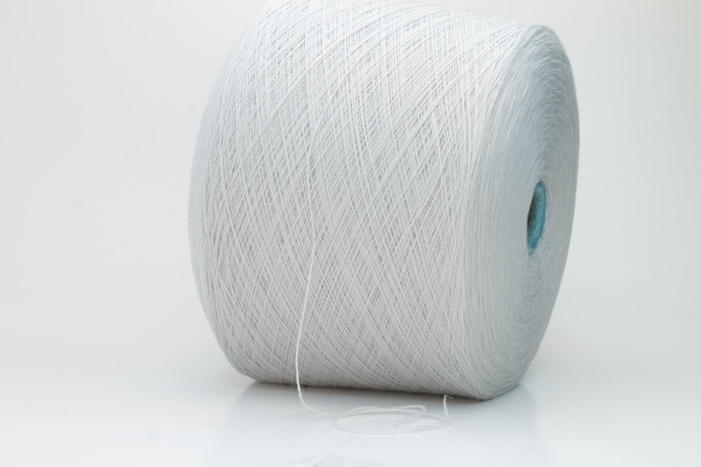 Close-up shot of Zegna Baruffa Merinos Cashwool yarn in Light Gray, showcasing the fine ply twist and dense, fluffy texture with subtle sheen.