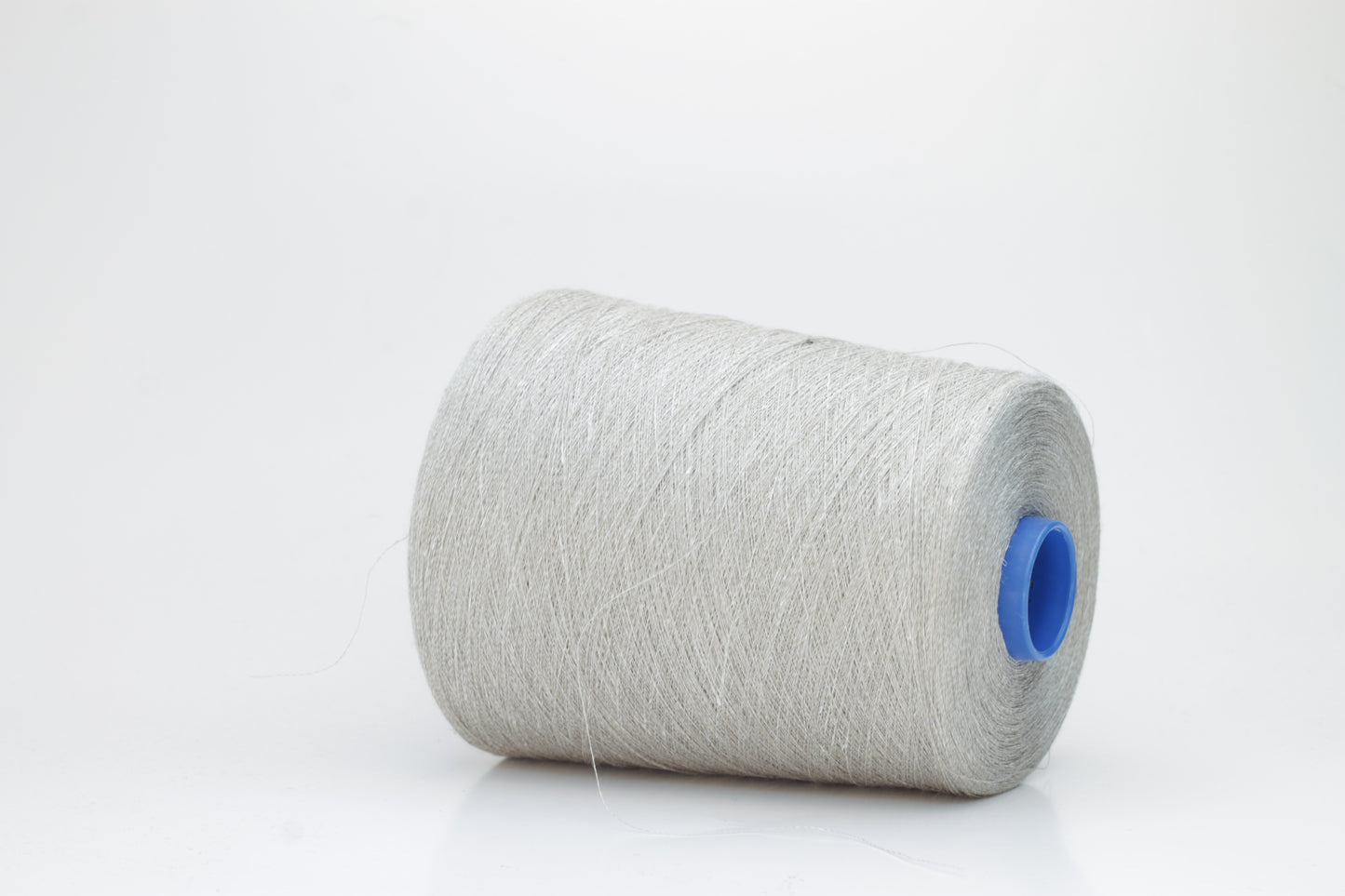 Fine, single-ply linen yarn in a rich charcoal gray. Reveals a crisp texture and subtle natural sheen, typical of pure linen fiber.