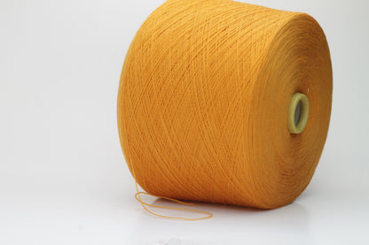 Close-up view of a vibrant orange Zegna Baruffa Merino yarn skein, showcasing the dense ply twist and smooth, fluffy texture with subtle sheen reflecting light.