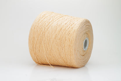 Close-up shot of a vibrant Muskemelon colored silk bourette yarn, showcasing its fluffy texture and intricate ply twist, with subtle sheen and depth.