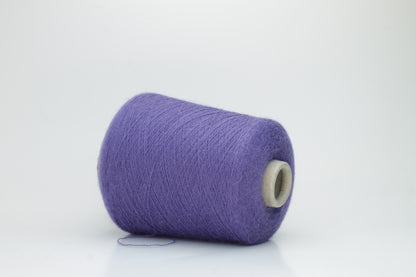 Rich purple 2-ply Alpaca Merino yarn, softly twisted with a gentle halo and subtle sheen, showcasing its deep, luxurious color saturation.