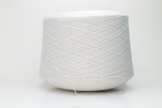 Close-up shot of creamy white Zegna Baruffa merino yarn, showcasing a dense, twisted ply structure and subtle sheen, with a fluffy texture inviting tactile exploration.