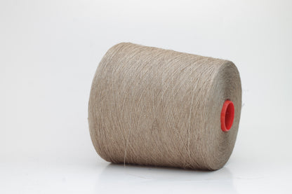Fine, single-ply linen yarn in a rich Natural Taupe. Reveals a crisp texture and subtle natural sheen, typical of pure linen fiber.