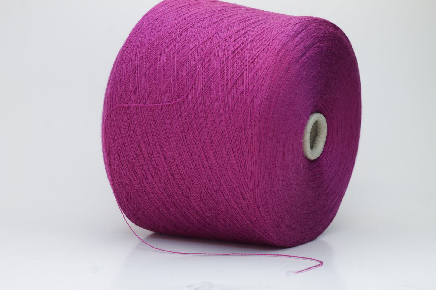 Close-up studio shot showcasing the rich purple color of Zegna Baruffa Merino Cashwool yarn. The yarn features a dense, twisted ply construction with a subtle sheen and inviting fluffiness.