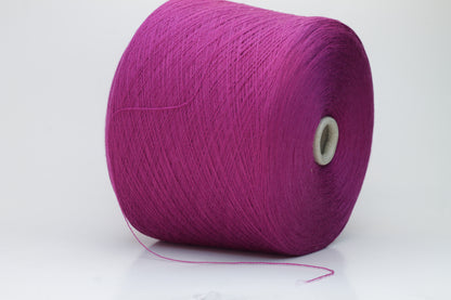 Close-up studio shot showcasing the rich purple color of Zegna Baruffa Merino Cashwool yarn. The yarn features a dense, twisted ply construction with a subtle sheen and inviting fluffiness.