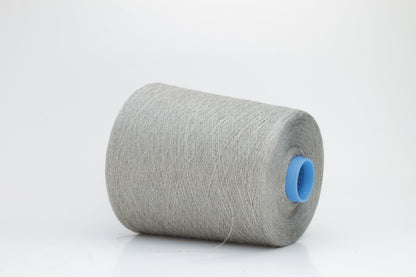 Fine, single-ply linen yarn in a Natural. Reveals a crisp texture and subtle natural sheen, typical of pure linen fiber.