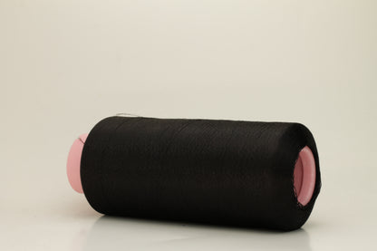 A skein of fine, single-ply 100% silk yarn, lustrous with a deep, rich Black hue, reflecting light softly.