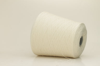 Close-up of a skein of pristine Ice White 100% cashmere yarn, showcasing its fine, evenly plied two-ply structure and delicate, soft halo.
