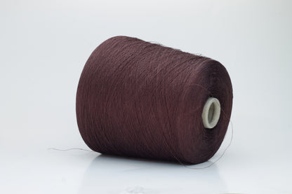 Close-up of a tightly twisted, fine-gauge yarn in a deep, warm earthy brown color, showing a subtle natural sheen from the linen fibers.