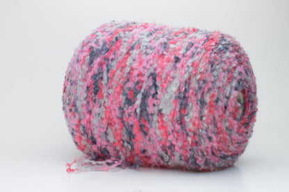 Close-up shot of multicolored SuperKidMohair yarn, showcasing its fluffy texture, slight sheen, and tight ply twist – a rich blend ready for knitting or weaving.