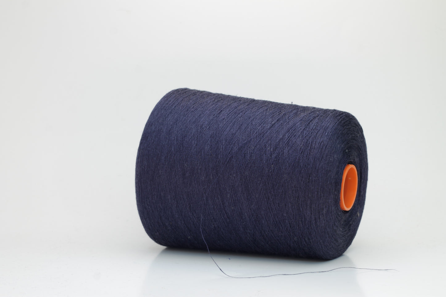 Fine, single-ply linen yarn in a rich Blue Boy. Reveals a crisp texture and subtle natural sheen, typical of pure linen fiber.