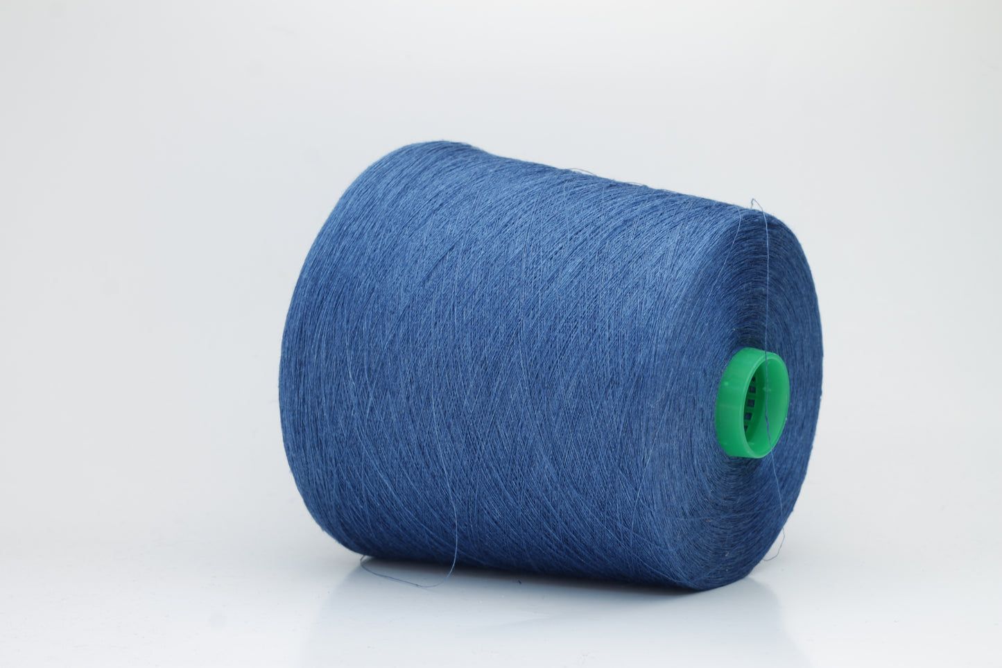 Fine, single-ply linen yarn in a rich Blue. Reveals a crisp texture and subtle natural sheen, typical of pure linen fiber.