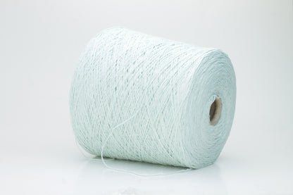 Close-up of a skein of unspun, single-ply bourette silk yarn. It has a natural, slightly textured, slubbed surface with a soft matte sheen in a serene acqua blue-green hue.