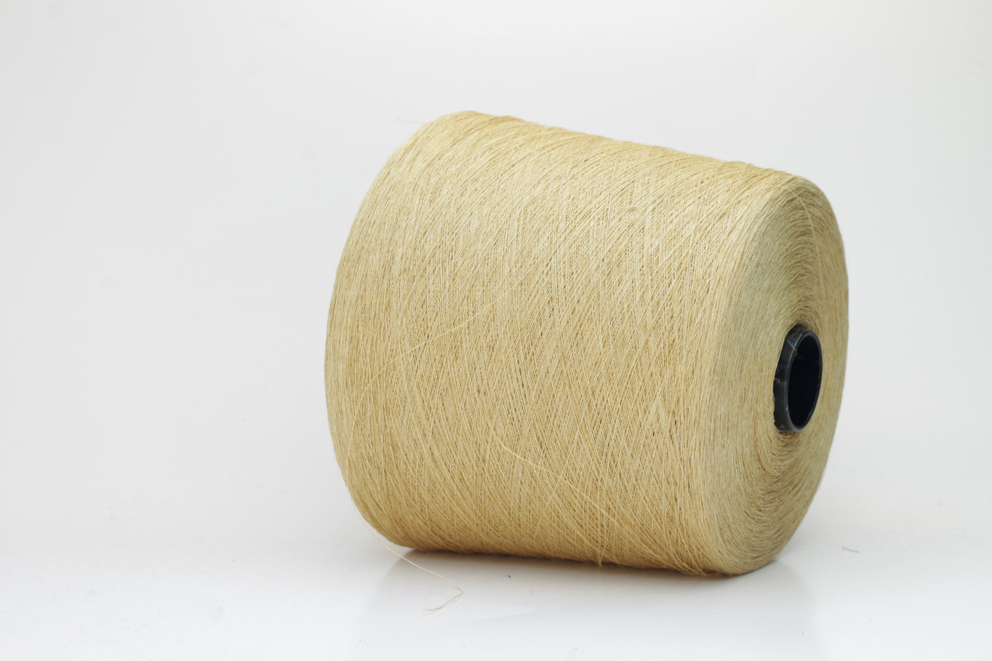 Fine, single-ply linen yarn in a rich Pale Butter. Reveals a crisp texture and subtle natural sheen, typical of pure linen fiber.