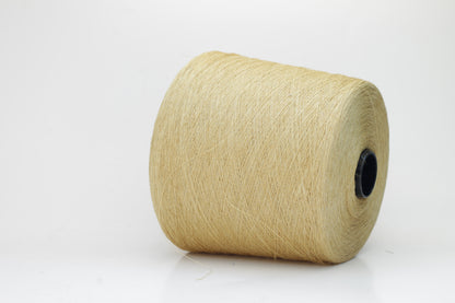 Fine, single-ply linen yarn in a rich Pale Butter. Reveals a crisp texture and subtle natural sheen, typical of pure linen fiber.