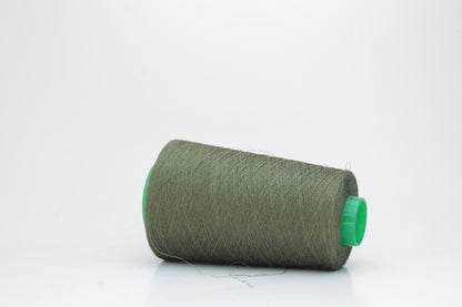Fine, single-ply linen yarn in a rich Army. Reveals a crisp texture and subtle natural sheen, typical of pure linen fiber.