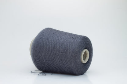 Rich Gray 2-ply Alpaca Merino yarn, softly twisted with a gentle halo and subtle sheen, showcasing its deep, luxurious color saturation.