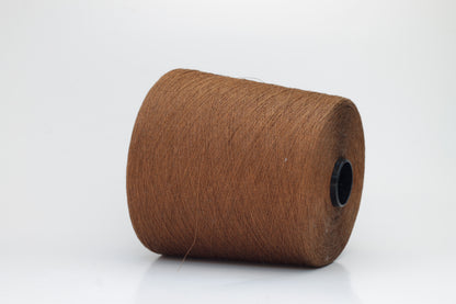 Fine, single-ply linen yarn in a Mostarda. Reveals a crisp texture and subtle natural sheen, typical of pure linen fiber.