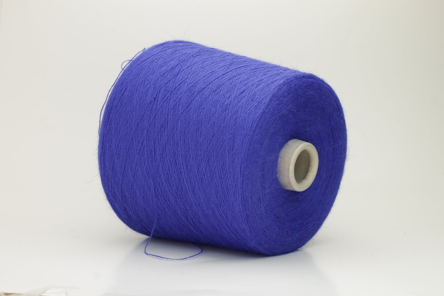 Angora 70%, 20% PA, 10% WV. Nm 1/15 Gold Extra. Color Royal Blue