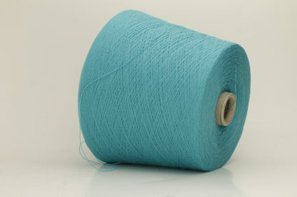 Close-up of a vibrant bright turquoise cashmere yarn hank, showcasing its fine, soft 2-ply twist and subtle, luxurious sheen.