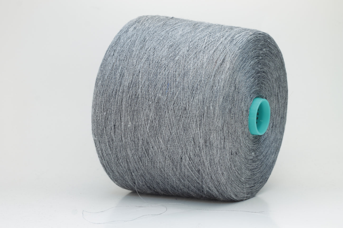 Fine, single-ply linen yarn in a rich Slate Blue-Gray. Reveals a crisp texture and subtle natural sheen, typical of pure linen fiber.