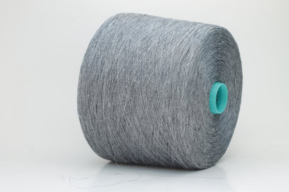 Fine, single-ply linen yarn in a rich Slate Blue-Gray. Reveals a crisp texture and subtle natural sheen, typical of pure linen fiber.