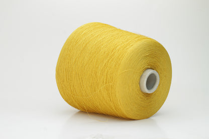 Close-up of a brightly twisted single-ply yarn, a sunny yellow color with a subtle matte finish and visible linen slubs throughout.