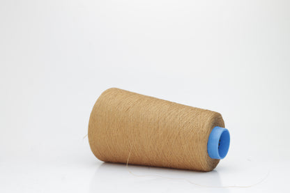 Fine, single-ply linen yarn in a rich Camel Brown. Reveals a crisp texture and subtle natural sheen, typical of pure linen fiber.