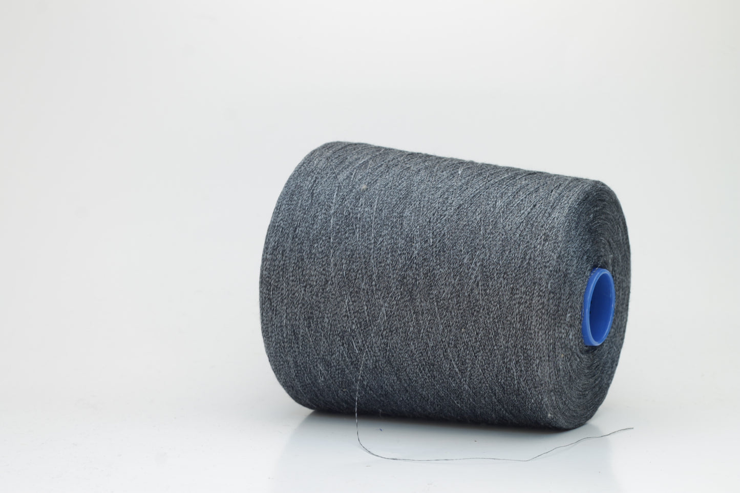 Fine, single-ply linen yarn in a rich Deep Sage Charcoal. Reveals a crisp texture and subtle natural sheen, typical of pure linen fiber.
