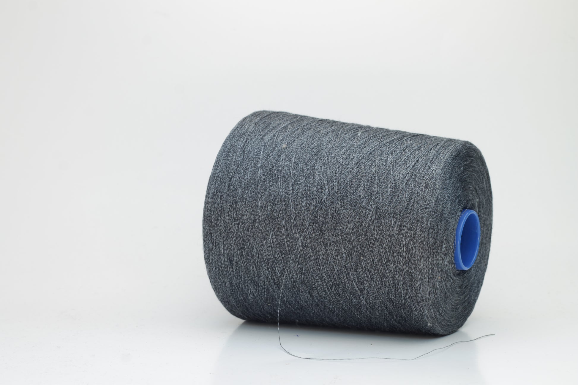 Fine, single-ply linen yarn in a rich Deep Sage Charcoal. Reveals a crisp texture and subtle natural sheen, typical of pure linen fiber.