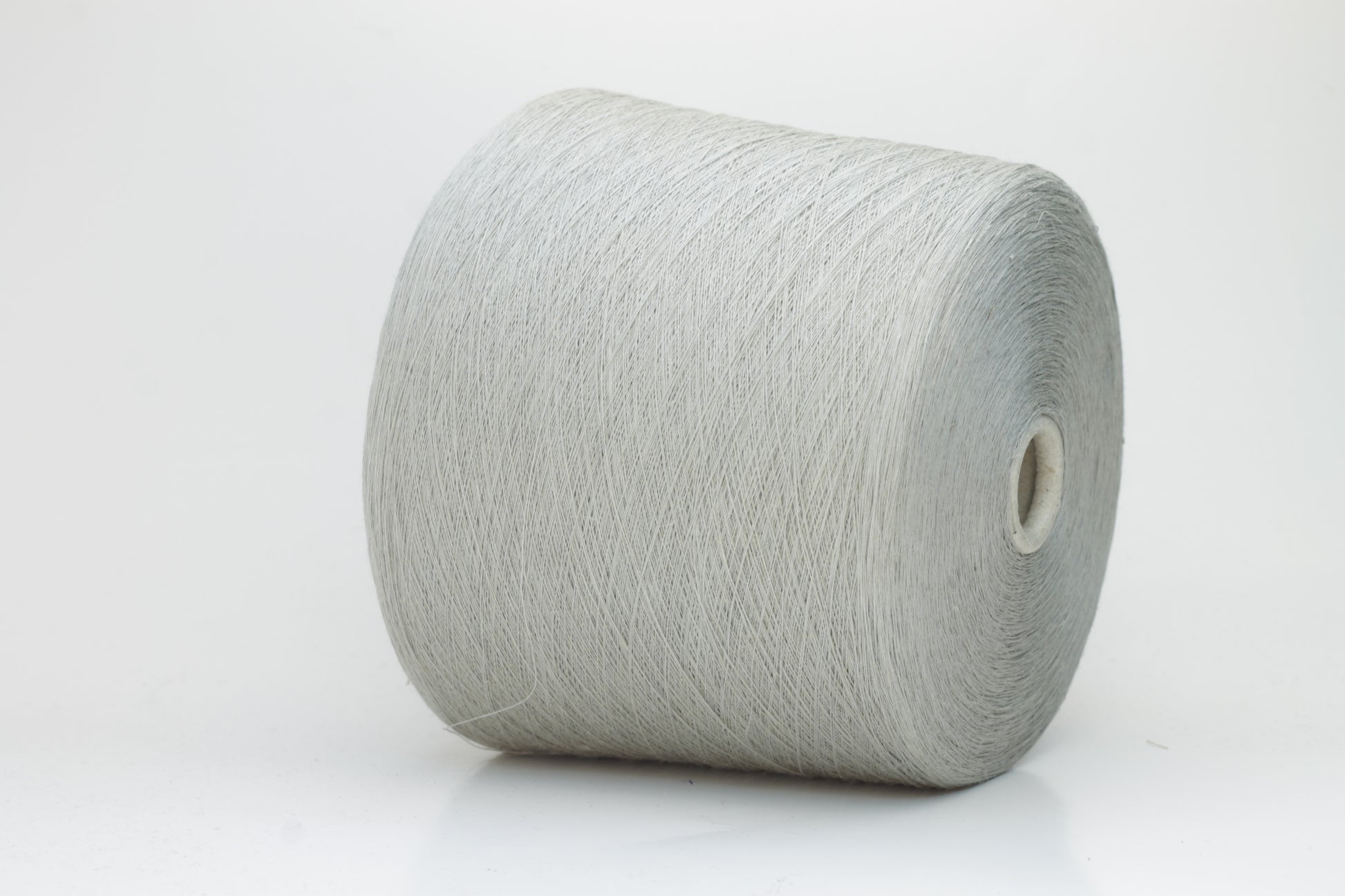 Fine, single-ply linen yarn in a rich Silver. Reveals a crisp texture and subtle natural sheen, typical of pure linen fiber.