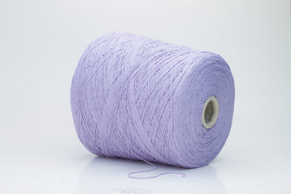 Close-up of a single strand of matte lavender silk bourette yarn, showcasing its natural slub texture and soft, nubbly appearance, coiled gently.