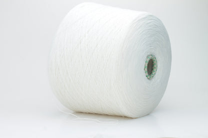 Close-up of a pristine white, two-ply cashmere yarn ball, subtly glowing with a luxurious, fine-fibered halo.