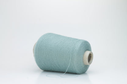 Dusty Mint 2-ply Alpaca Merino yarn, softly twisted with a gentle halo and subtle sheen, showcasing its deep, luxurious color saturation.