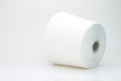 A bright white, single-ply yarn, subtly twisted, revealing the natural texture of linen fibers with a soft, understated sheen.