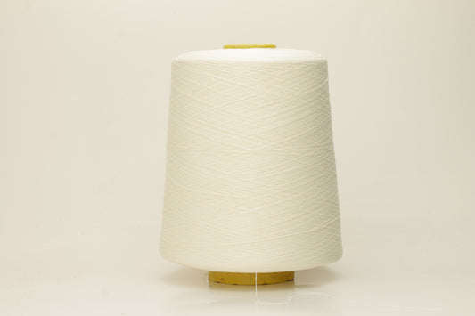 Close-up of pristine white, finely twisted silk yarn, showcasing its luminous sheen and smooth, consistent texture. The individual plies are barely discernible due to its delicate, high-count spin, reflecting light beautifully.