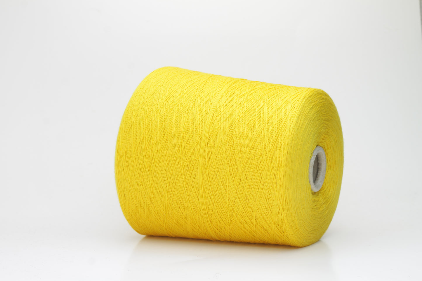 Close-up of luxurious Yellow Merino wool yarn, two-ply twist with a soft, subtle sheen, and fine, consistent thread structure.