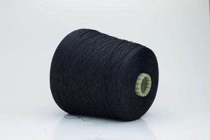 Spool of rich, deep black silk yarn, showcasing its fine, smooth plies and radiant, natural luster against a soft background.