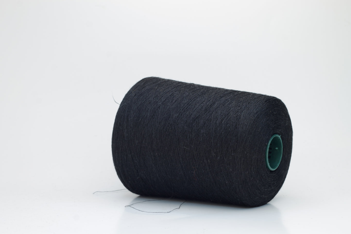 Fine, single-ply linen yarn in a Black. Reveals a crisp texture and subtle natural sheen, typical of pure linen fiber.