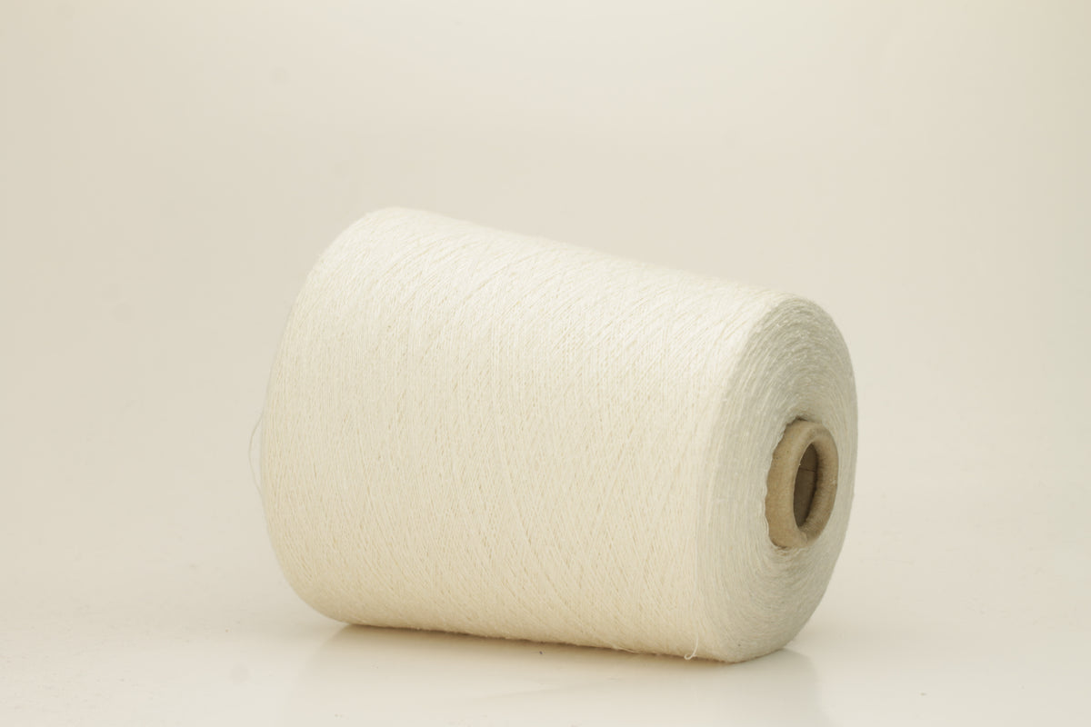 A tightly twisted single strand of luxurious deep royal blue silk yarn, reflecting light with a soft, natural sheen.