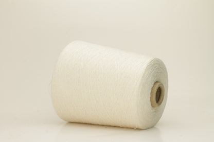 A tightly twisted single strand of luxurious deep royal blue silk yarn, reflecting light with a soft, natural sheen.