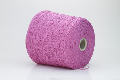 Close-up shot of the Rosa Fuxia Silk Bourette yarn, showcasing its shimmering, fluffy texture and tightly twisted ply structure. The silk fibers exhibit a subtle sheen with rich color depth.