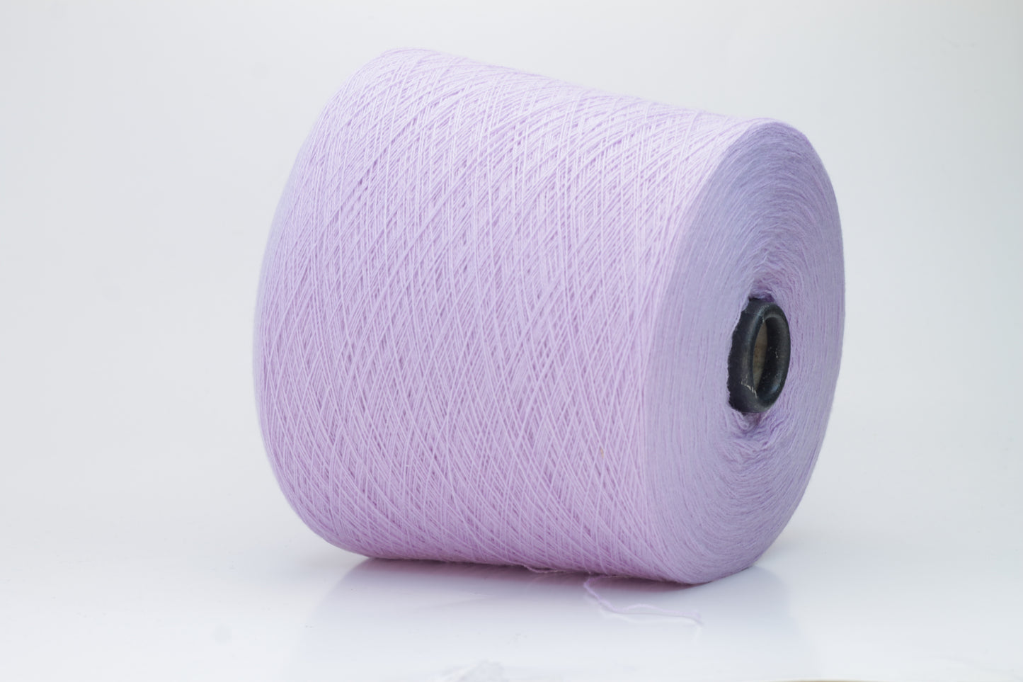 Close-up of soft, delicate two-ply cashmere yarn in a serene lavender hue, exhibiting a subtle halo and gentle sheen.