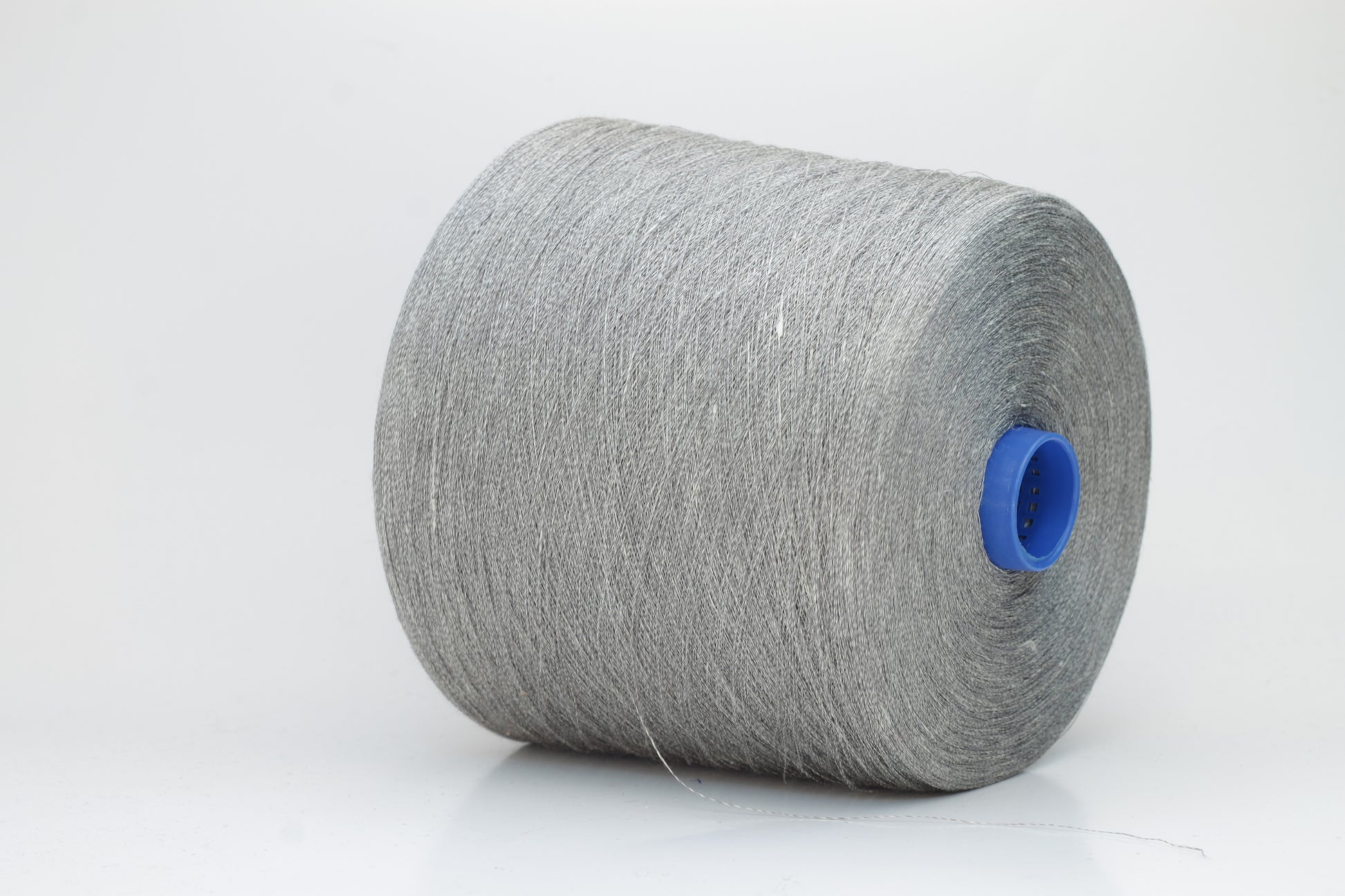 Fine, single-ply linen yarn in a rich charcoal gray. Reveals a crisp texture and subtle natural sheen, typical of pure linen fiber.