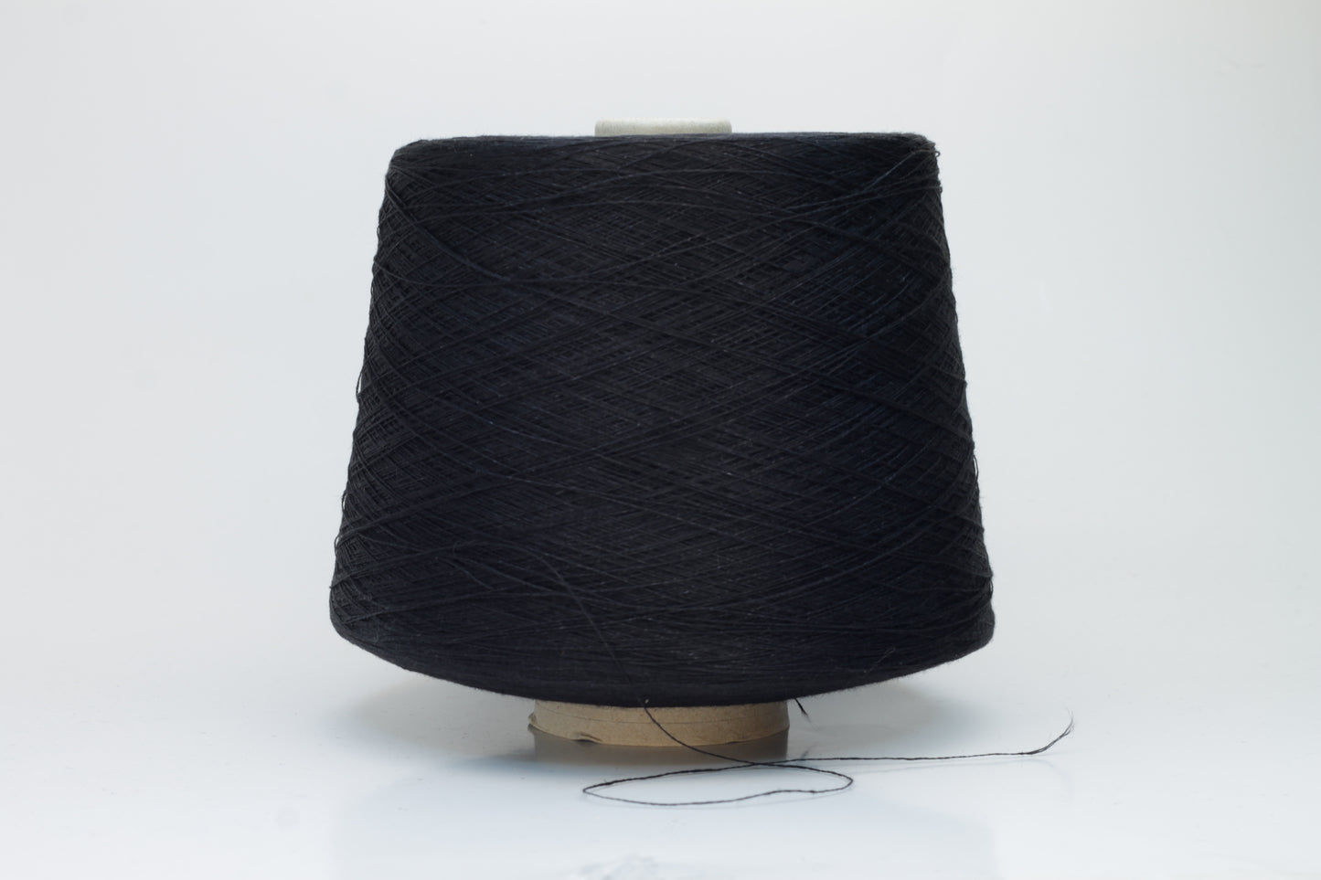 Finely spun Nm 2/26 linen yarn in a rich, deep ardesia slate gray, showcasing a smooth, uniform twist and subtle natural sheen.