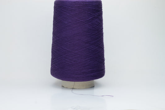 Rich, deep purple yarn wound into a soft, slightly textured skein, exhibiting a subtle natural sheen from its linen content and a smooth, even twist.