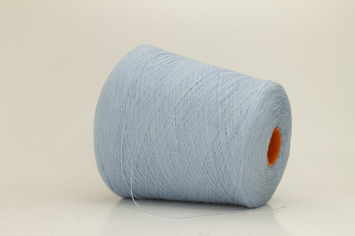 Close-up of a luxurious, soft Atlantic blue 2-ply cashmere yarn, subtly twisted with a delicate sheen and rich, deep color saturation.