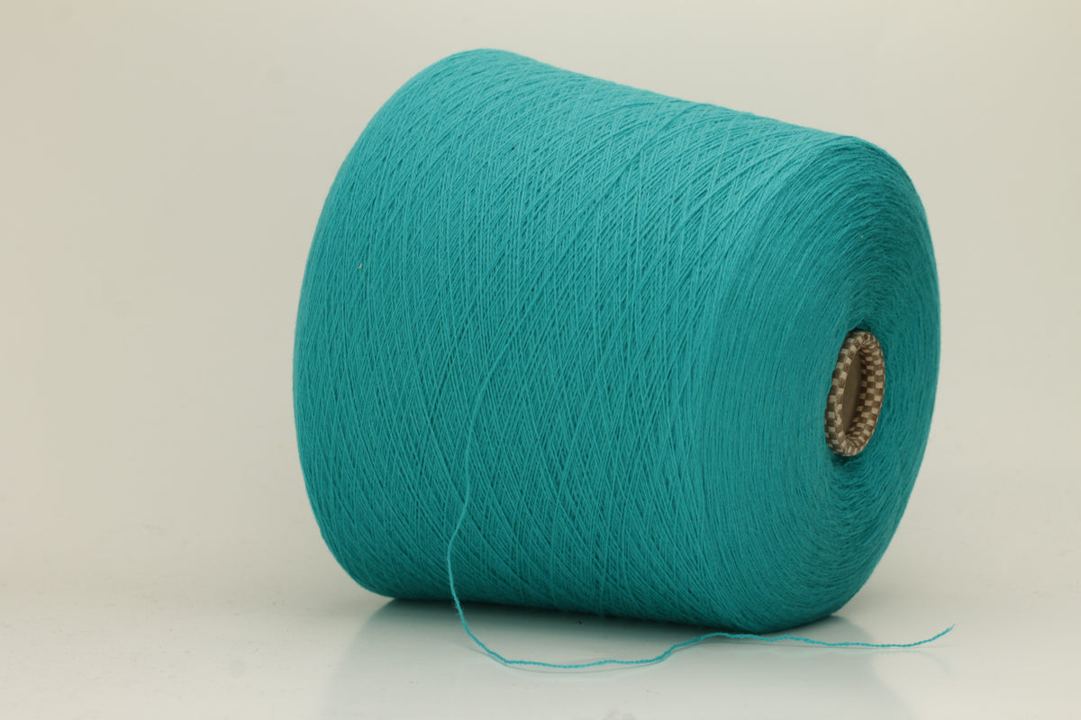 Vibrant grasshopper-green cashmere yarn. Soft, fine ply, subtle halo, and luxurious sheen. Displays rich, consistent color depth.