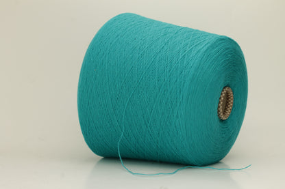 Vibrant grasshopper-green cashmere yarn. Soft, fine ply, subtle halo, and luxurious sheen. Displays rich, consistent color depth.