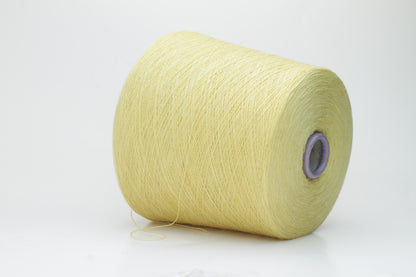 Close-up image of a vibrant yellow ZEGNA Baruffa merino yarn skein, showcasing its fine ply twist and dense thread structure with subtle sheen and inviting fluffiness.